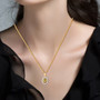 yellow apatite yellow and white diamond double halo pendant necklace in 18k yellow gold over sterling silver worn around the neck