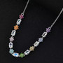 rainbow moonstone and multi gemstone necklace in rhodium over sterling silver shown in a lifestyle photo