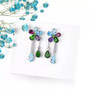 full view of multi gemstone flower dangle earrings in rhodium over sterling silver