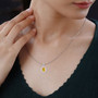 yellow and white cubic zirconia pendant necklace in rhodium over sterling silver worn around the neck