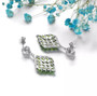 full view of chrome diopside and white zircon dangle earrings in rhodium over sterling silver