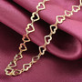 heart link necklace in 18k yellow gold over sterling silver shown in a lifestyle photo