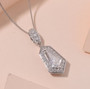 moissanite shield cut halo pendant necklace in rhodium over sterling silver shown in a lifestyle photo