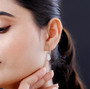 moissanite shield cut halo lever back earrings in rhodium over sterling silver worn on the ear