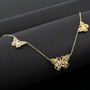 10k yellow gold and 10k white gold butterfly station necklace shown in a lifestyle photo