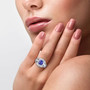 tanzanite and white zircon ring in 18k white gold worn on a hand
