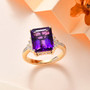 emerald cut amethyst and baguette and round diamond ring in 10k yellow gold shown in a lifestyle photo