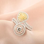 pink yellow and white diamond bypass ring in 14k white gold shown in a lifestyle photo