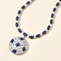 blue star sapphire and rainbow moonstone necklace in rhodium over sterling silver shown in a lifestyle photo