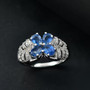 kyanite and white zircon butterfly ring in rhodium over sterling silver shown in a lifestyle photo