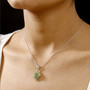 tsavorite garnet cluster two-tone 18k yellow gold and rhodium over sterling silver pendant necklace worn around the neck