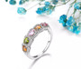 multi tourmaline and white zircon band ring in rhodium over sterling silver shown in a lifestyle photo