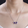 amethyst and white zircon butterfly necklace in rhodium over sterling silver worn around the neck