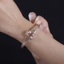 peach quartz triplet bangle bracelet in 18k rose gold and rhodium over sterling silver worn on a wrist