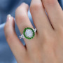 opal chrome diopside and zircon infinity shank halo ring in rhodium over sterling silver worn on a hand