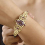 rose de france amethyst and rhodolite garnet bangle bracelet in 18k yellow gold and rhodium over sterling silver worn on a wrist