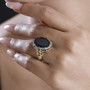 black spinel ring in 18k yellow gold and rhodium over sterling silver worn on a hand