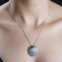 blue apatite seashell pendant necklace in rhodium over sterling silver worn around the neck