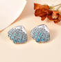 blue apatite seashell earrings in rhodium over sterling silver shown in a lifestyle photo