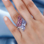 tanzanite pink tourmaline and white zircon bypass ring in rhodium over sterling silver worn on a hand