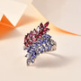 tanzanite pink tourmaline and white zircon bypass ring in rhodium over sterling silver shown in a lifestyle photo