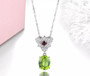 peridot garnet and white zircon lotus necklace in rhodium over sterling silver shown in a lifestyle photo