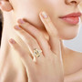 turkizite and diamond solitaire ring in 18k yellow gold worn on a hand