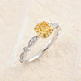 cushion yellow and white diamond ring in 18k two-tone gold shown in a lifestyle photo
