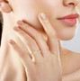 cushion yellow and white diamond ring in 18k two-tone gold worn on a hand