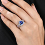 tanzanite mahenge spinel and diamond halo ring in 950 platinum worn on a hand