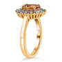 side view of orange tourmaline champagne and white diamond halo ring in 14k yellow gold