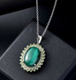 malachite and peridot halo pendant necklace in rhodium over sterling silver shown in a lifestyle photo