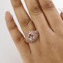 morganite and white zircon ring in 18k rose gold over sterling silver worn on a hand