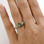 green tourmaline trilogy ring 18k yellow gold and rhodium over sterling silver worn on a hand