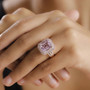 kunzite pink sapphire and zircon double halo 18k rose gold over sterling silver ring worn on a hand