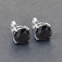 black diamond 14k white gold round stud earrings shown in a lifestyle photo
