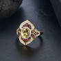 yellow apatite brown and white zircon ring in 18k yellow gold over sterling silver shown in a lifestyle photo