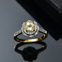 yellow apatite and white zircon 18k yellow gold over sterling silver halo ring shown in a lifestyle photo