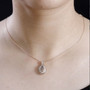 champagne and white diamond 18k rose gold over sterling silver custer pendant necklace worn around the neck