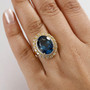 london blue topaz blue topaz and zircon 18k yellow gold over sterling silver double halo ring worn on a hand