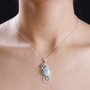 larimar and black spinel seahorse pendant necklace in rhodium over sterling silver worn around the neck
