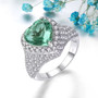 heart green fluorite and white zircon halo statement ring in rhodium over sterling silver shown in a lifestyle photo