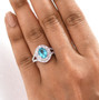 blue apatite pink sapphire and diamond double halo split shank ring in 10k white gold worn on a hand