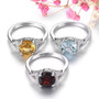 full view of garnet and white zircon rhodium over sterling silver ring