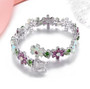 close up of rhodolite garnet ethiopian opal and chrome diopside rhodium over sterling silver tennis bracelet
