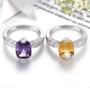 close up of citrine and white zircon rhodium over sterling silver solitaire ring