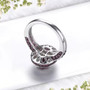 back view of rhodolite garnet and white zircon double halo ring in black and white rhodium over sterling silver