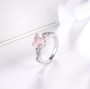 close up of heart rose quartz and white zircon infinity shank ring in rhodium over sterling silver