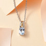 aquamarine solitaire two-tone 18k yellow gold and rhodium over sterling silver pendant necklace shown in a lifestyle photo
