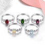 close up of ethiopian opal and white zircon rhodium over sterling silver bow ring